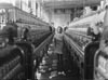 1908 niña trabajando en una fábrica textil